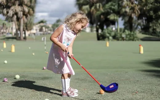 a girl playing golf