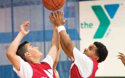 a few men playing basketball