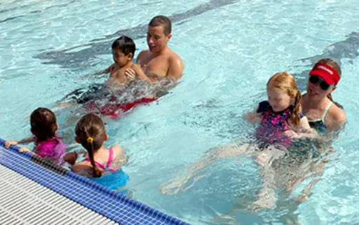 a group of people in a pool