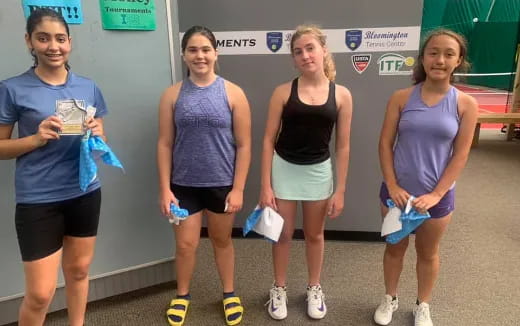 a group of women posing for a photo