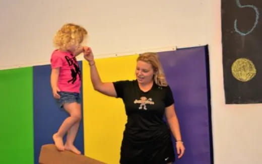 a person and a child jumping in the air