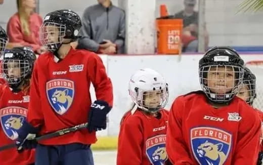 a group of kids wearing helmets