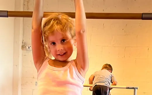 a girl with her arms up