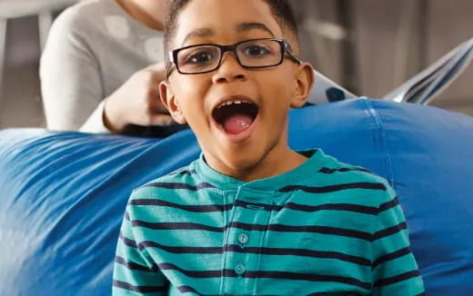 a boy wearing glasses