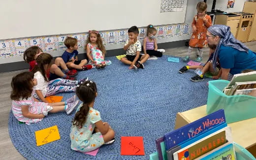 a group of children sitting on the floor