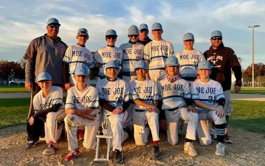 a group of baseball players posing for a photo