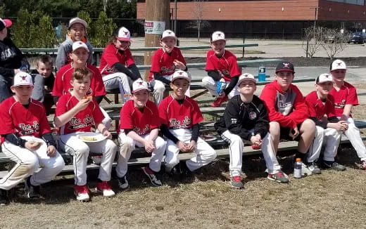 a group of people wearing red uniforms