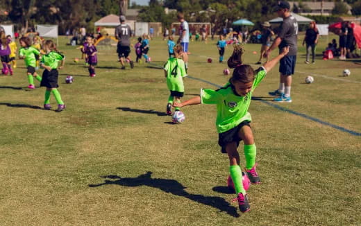 a group of kids playing football
