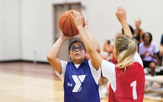 a boy holding a basketball