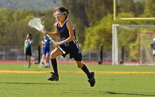 a person playing field hockey