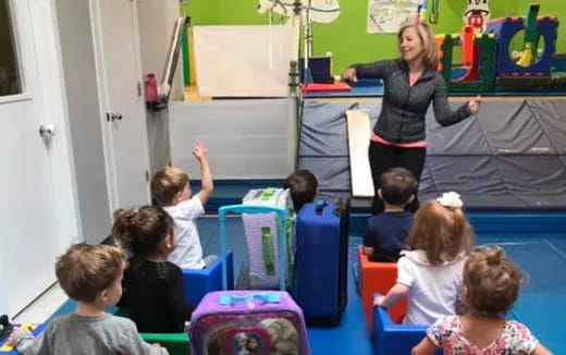 a teacher teaching her students