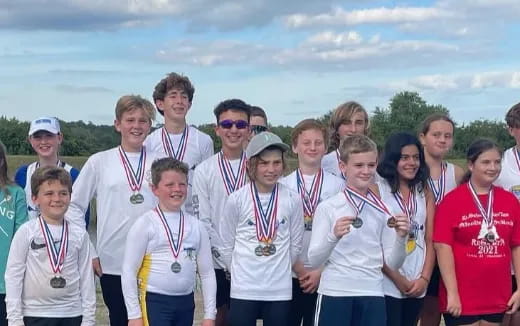 a group of people wearing medals