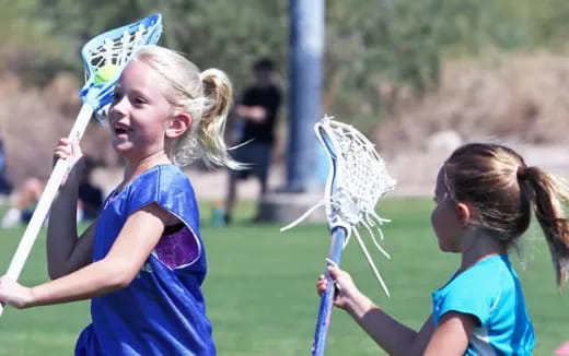 a couple of girls holding bows and arrows