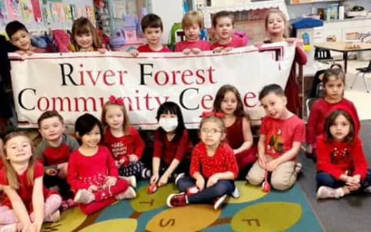 a group of children holding a banner