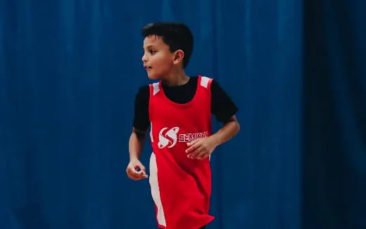 a boy in a red shirt