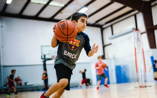 a boy playing basketball