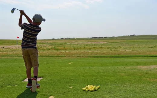 a boy playing frisbee