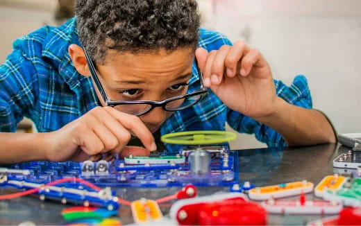 a boy playing with toys