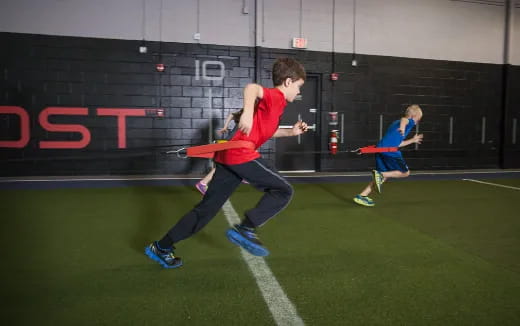 a person running with a frisbee