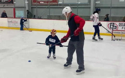 a person and a child on ice