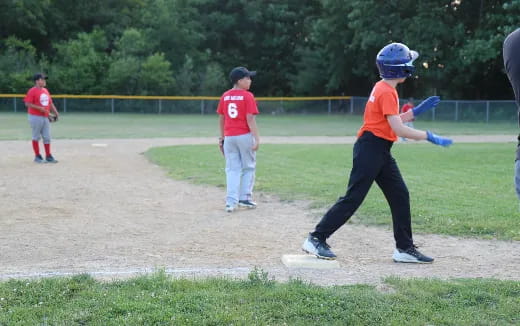 a kid swinging a baseball bat