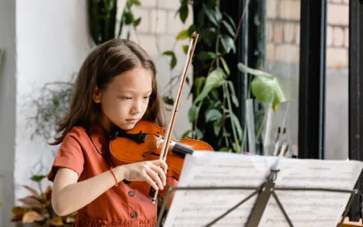 a girl playing an instrument