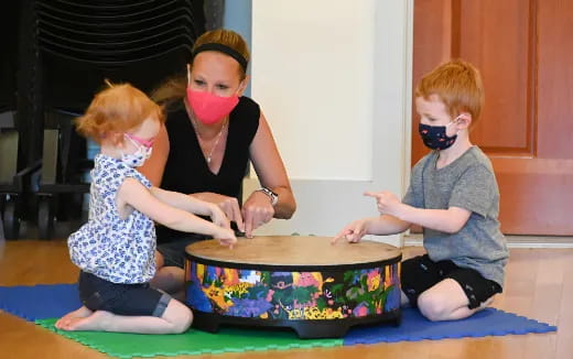 a group of children playing with a toy