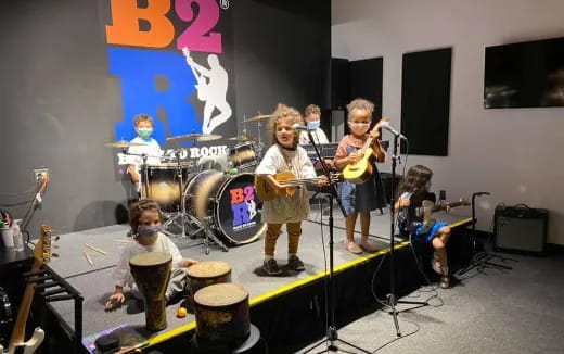 a group of kids playing instruments