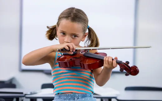 a girl playing a violin