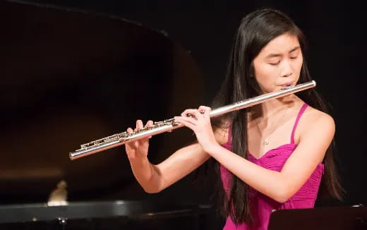 a woman playing a violin