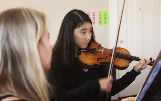 a person playing a violin