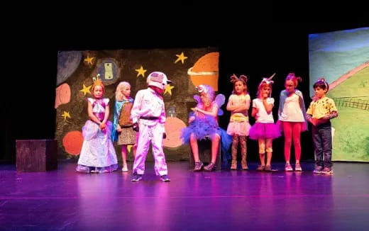 a group of children on a stage