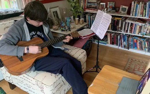 a person playing a guitar