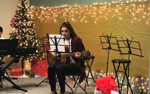 a person playing a guitar