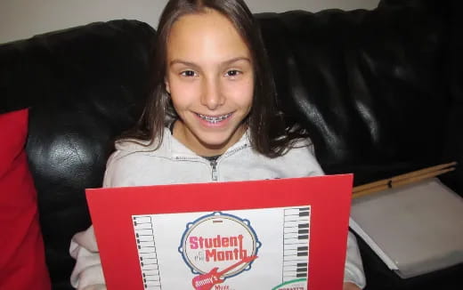 a girl holding a box