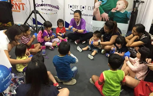 a group of children sitting on the floor