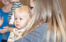 a person holding a baby