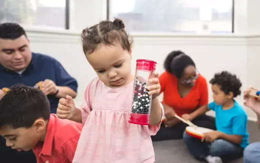 a group of children sitting in a classroom