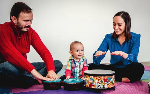a man and woman with a baby