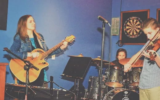 a group of people playing instruments