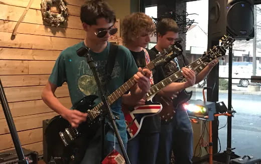 a group of men playing guitars