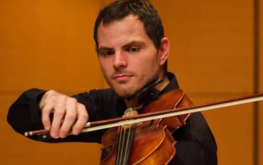 a man playing a violin