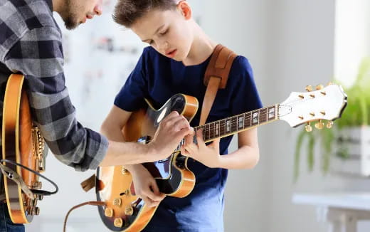 a person playing a guitar