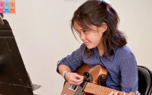 a person playing a guitar