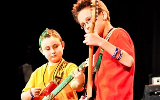 a man and a woman playing instruments