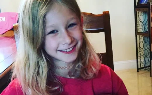 a girl smiling for the camera