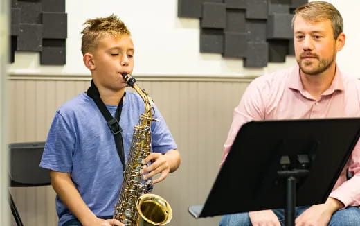 a man playing a saxophone