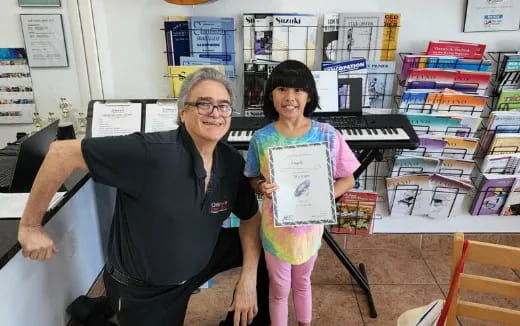 a person and a child holding a piece of paper