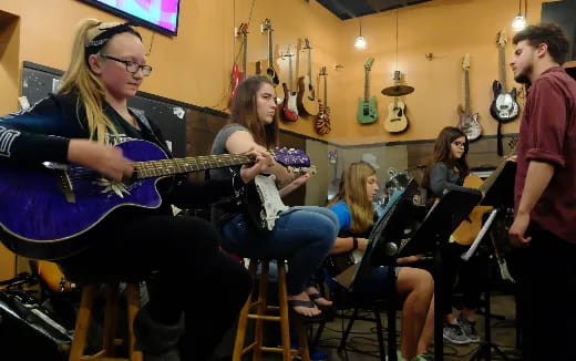 a group of people playing instruments