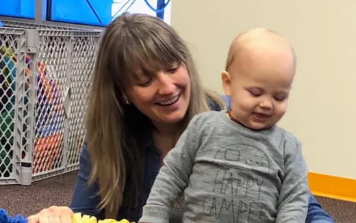 a person holding a baby